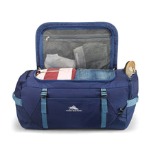 Load image into Gallery viewer, Open navy blue High Sierra duffel backpack packed with clothes.
