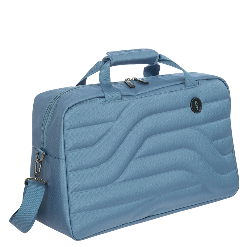 Front angled view of the grey blue duffle bag. Set on a white background. 