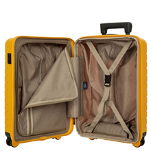 Load image into Gallery viewer, Opened view of the suitcase on a white background. The lining is a light brown color. The lid&#39;s side features zipper-closed compartment, and the back side features a set of straps to maintain items in place. 
