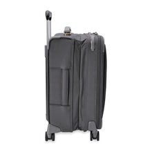 Load image into Gallery viewer, Side view of the suitcase with the expandable feature extended.
