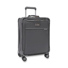Load image into Gallery viewer, Angled front view of the suitcase with the telescopic handle partly pulled up.
