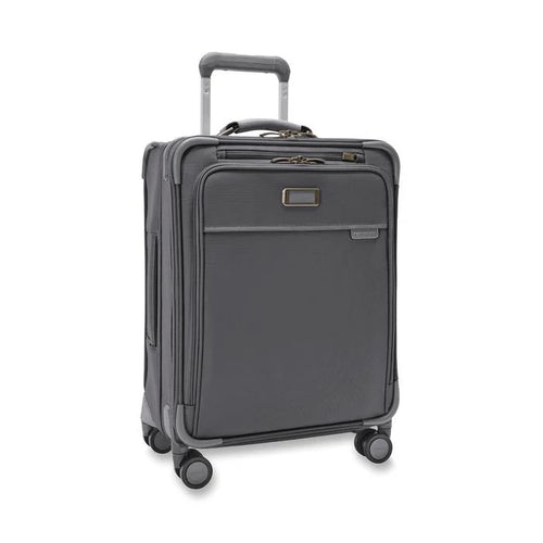 Angled front view of the suitcase with the telescopic handle partly pulled up.