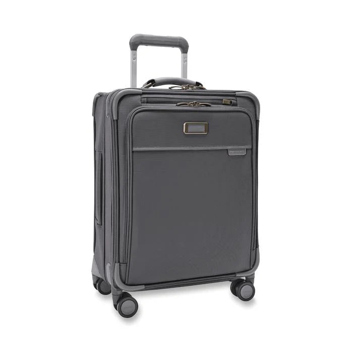 Angled front view of the suitcase with the telescopic handle partly pulled up.