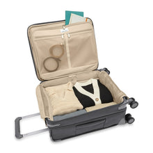 Load image into Gallery viewer, Interior Packing Compartment showing zippered lid compartment and main packing compartment with clothes and accessories.
