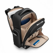 Load image into Gallery viewer, Angled front panel view of the black backpack with the front, back, and back compartments unzipped. 
