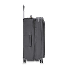 Load image into Gallery viewer, Side view of the suitcase with the telescopic handle partly pulled up. The expandable feature is expanded. 
