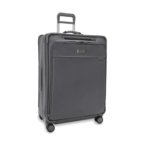 Front angled view of the suitcase with the telescopic handle partly pulled up.
