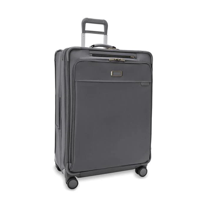 Front angled view of the suitcase with the telescopic handle partly pulled up.
