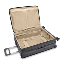 Load image into Gallery viewer, The suitcase laid down with the main compartment unzipped and lifted. 
