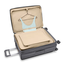 Load image into Gallery viewer, The suitcase is laid down. The front lid&#39;s compartment unzipped.
