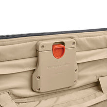 Load image into Gallery viewer, Close-up view of the Briggs &amp; Riley (patent pending) CX compression mechanism in the main compartment.


