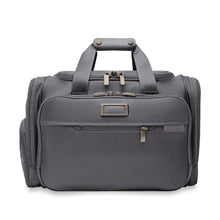 Load image into Gallery viewer, Front view of the steel gray undeseat duffle bag. The front features two zipper compartments, a leather monogram tag, and the Briggs and Riley Logo. 

