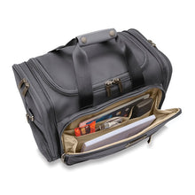 Load image into Gallery viewer, Angled view of the steel gray underseat duffle bag. The front panel zipper is opened and shown storing different accessories.
