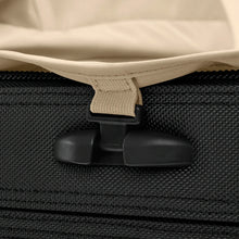 Load image into Gallery viewer, Close-up to the black suitcase  handle attachment.
