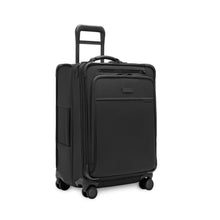 Load image into Gallery viewer, Angled front panel view of the black suitcase with the telescopic handle partly extended.
