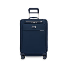 Load image into Gallery viewer, Front panel view of the navy blue suitcase with the telescopic handle extended. 

