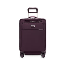 Load image into Gallery viewer, Front panel view of the plum suitcase with the telescopic handle partly extended.
