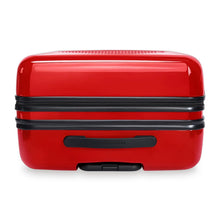 Load image into Gallery viewer, Top panel view of the red suitcase with black accents. It features a grip handle and a telescopic handle. 

