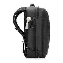 Load image into Gallery viewer, Side panel view of the black backpack with a water bottle tucked into the pocket. 
