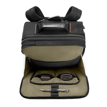 Load image into Gallery viewer, Interior view of the backpack's front compartment, featuring pockets and a pen holder. 
