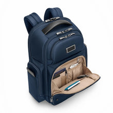 Load image into Gallery viewer, Angled front panel view of the navy blue backpack with the front compartment unzipped. It features organization pockets.
