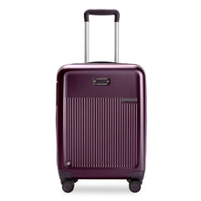 Load image into Gallery viewer, Front Panel View of the plum colored hard shell suitcase. It has a ridged front panel, and the telescoping handle extended.

