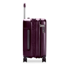 Load image into Gallery viewer, Side Panel view of the plum-colored suitcase with the expandable feature unzipped.
