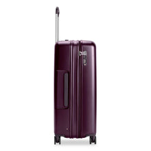 Load image into Gallery viewer, Side view of the suitcase with the telescopic handle partly pulled up. It features a grab handle and a TSA 3-digit combination lock.
