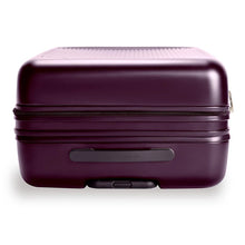 Load image into Gallery viewer, Top view of the plum-colored hard shell suitcase. A grab handle is featured on this side.
