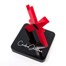 Load image into Gallery viewer, Angled top view of the Red &#39;X&#39; figure on a black base. The white text &#39;Ciudad Juarez&#39; is printed in white with a hand-written font. 
