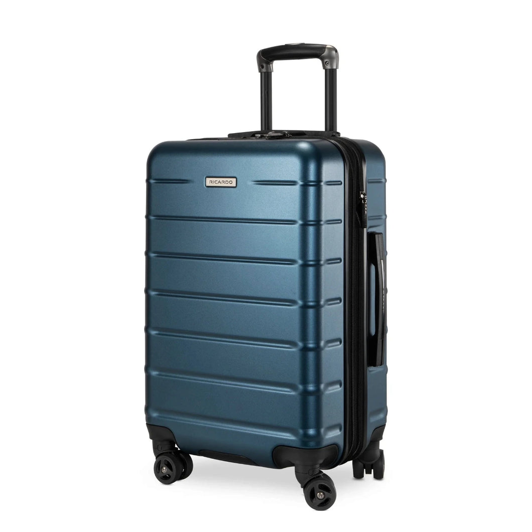 Angled front panel view of the navy blue hard shell suitcase. 