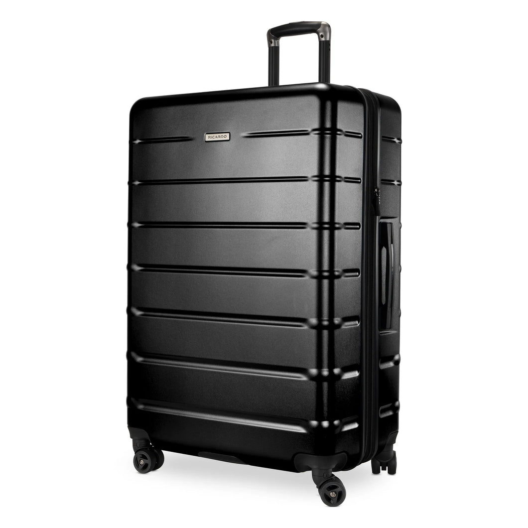Angled front view of the black hard shell suitcase. 