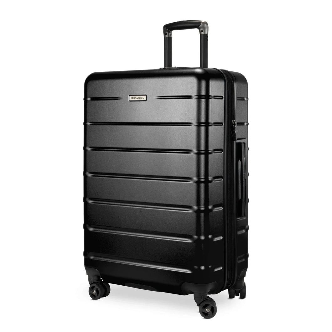 Angled front panel view of the black hard shell suitcase. 