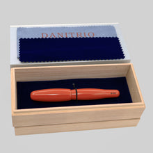 Load image into Gallery viewer, Orange Red Tamenuri pen presented inside its original wooden gift box with a velvet lining and polishing cloths.
