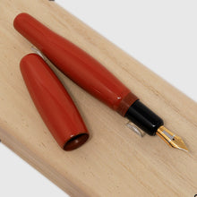 Load image into Gallery viewer, Uncapped view of the orange red Tamenuri fountain pen.
