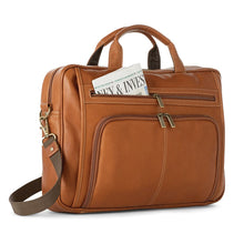 Load image into Gallery viewer, Angled front view of the tan briefcase. A newspaper is tucked inside the front compartment. 
