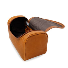 Load image into Gallery viewer, Angled view of the Leather Shave Kit in tan. The main compartment is open.
