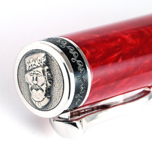 Load image into Gallery viewer, Angled close up to the cap top's silver disk with an engraving of Garibaldi's face.
