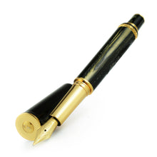 Load image into Gallery viewer, Angled front view of the pen with the cap set behind the nib.
