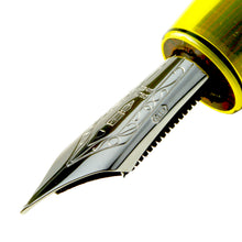 Load image into Gallery viewer, Side close up to the fountain pen nib. It features engraved decorations, de Delta logo, and hallmark.
