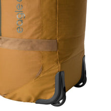 Load image into Gallery viewer, Angled close up to the wheels on the Safari tan duffle bag 

