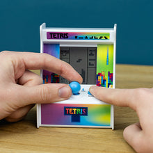 Load image into Gallery viewer, Miniature Tetris game arcade machine with two hands playing with it on a wooden table
