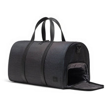 Load image into Gallery viewer, Angled front view of the duffle bag with the shoe compartment on the side unzipped. 
