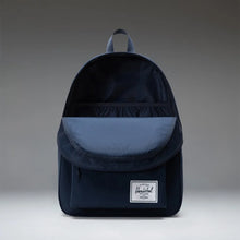 Load image into Gallery viewer, Front panel view of the navy blue backpack with the main compartment opened. The interior has a matching blue fabric lining. 
