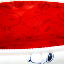 Load image into Gallery viewer, Interior close up to the hip pack bag. It features a red fabric lining with Snoopy pattern print. 
