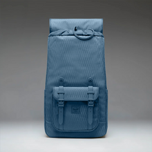 Load image into Gallery viewer, Front panel view of the blue diamond-pattern backpack with the top flap tilted back. It features a draw-string closure. 
