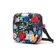 Front view Colorful Logo brick floral-patterned bag with Herschel Supply Co. branding.