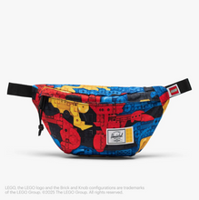 Load image into Gallery viewer, Front view of the hip pack with abstract Lego brick print.
