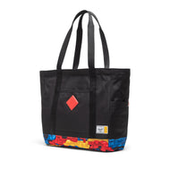 Angled front view of the black tote bag with colorful Lego brick pattern at the bottom.