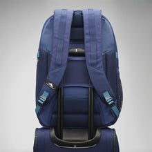 Load image into Gallery viewer, Back panel view of the blue backpack attached to the telescopic handle of a suitcase.
